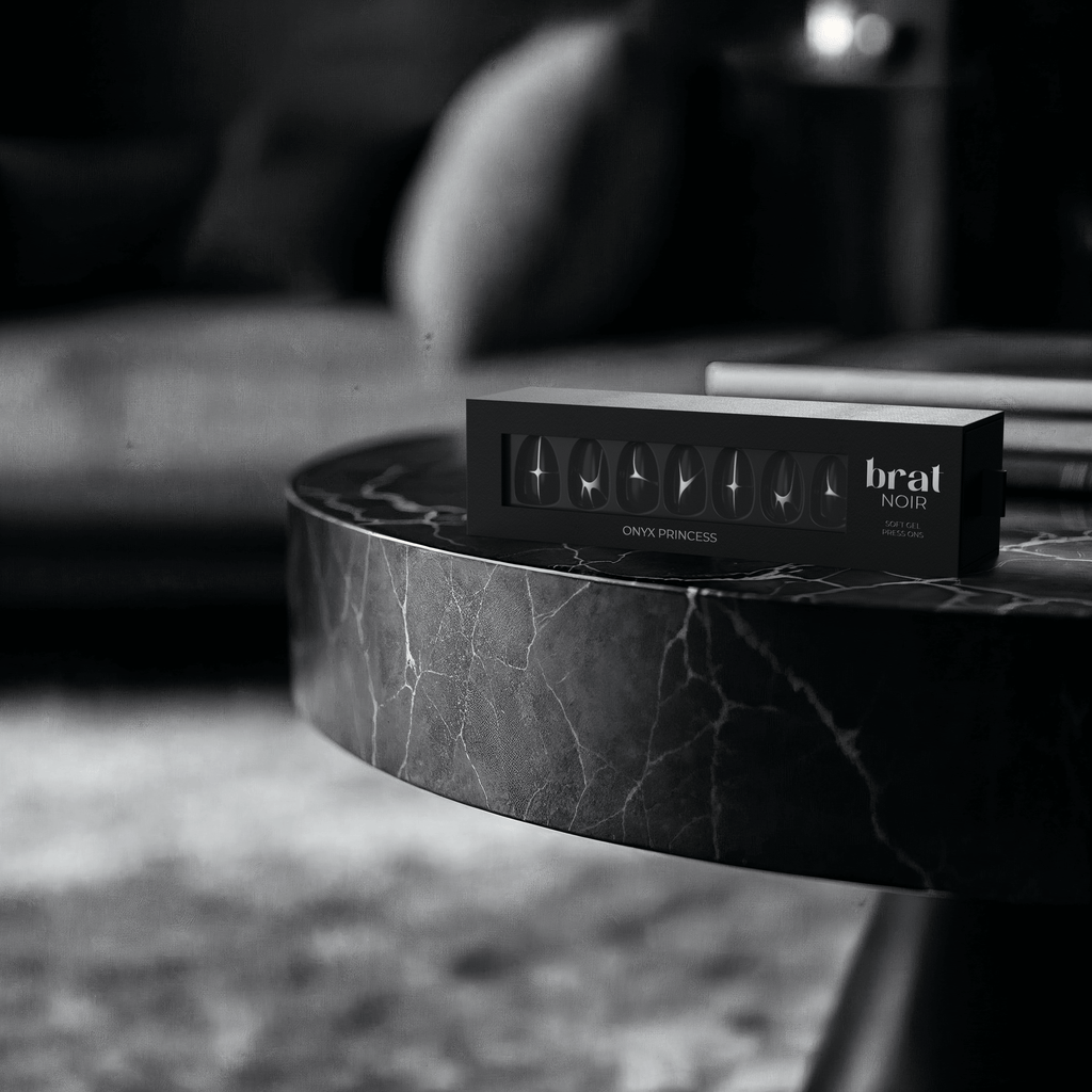 black box sitting on a table displaying nails